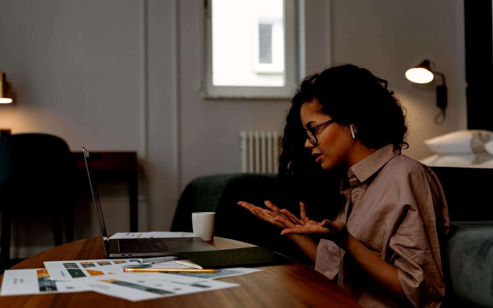 A mentor sharing perspective with a leader over notes