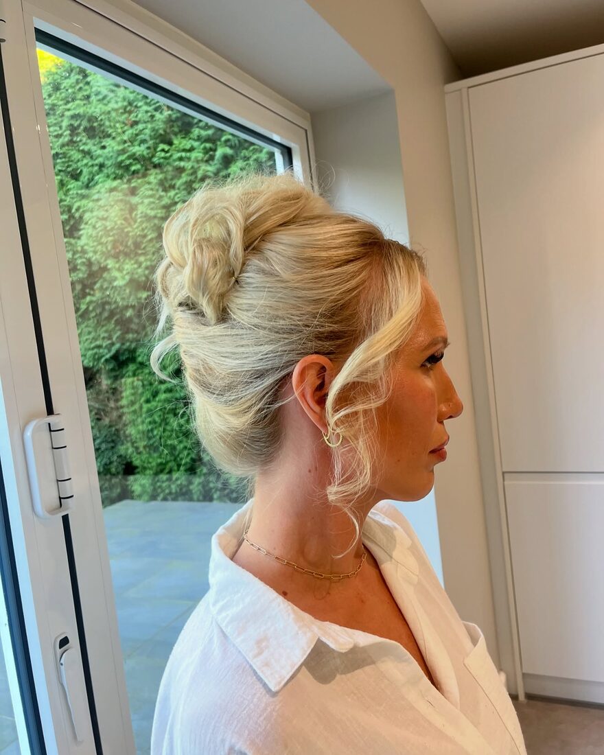 Elegant bridal up-do by the window
