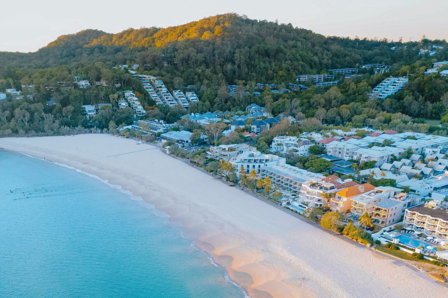 Aerial view of Noosa Main Beach at golden hour, on the Sunshine Coast